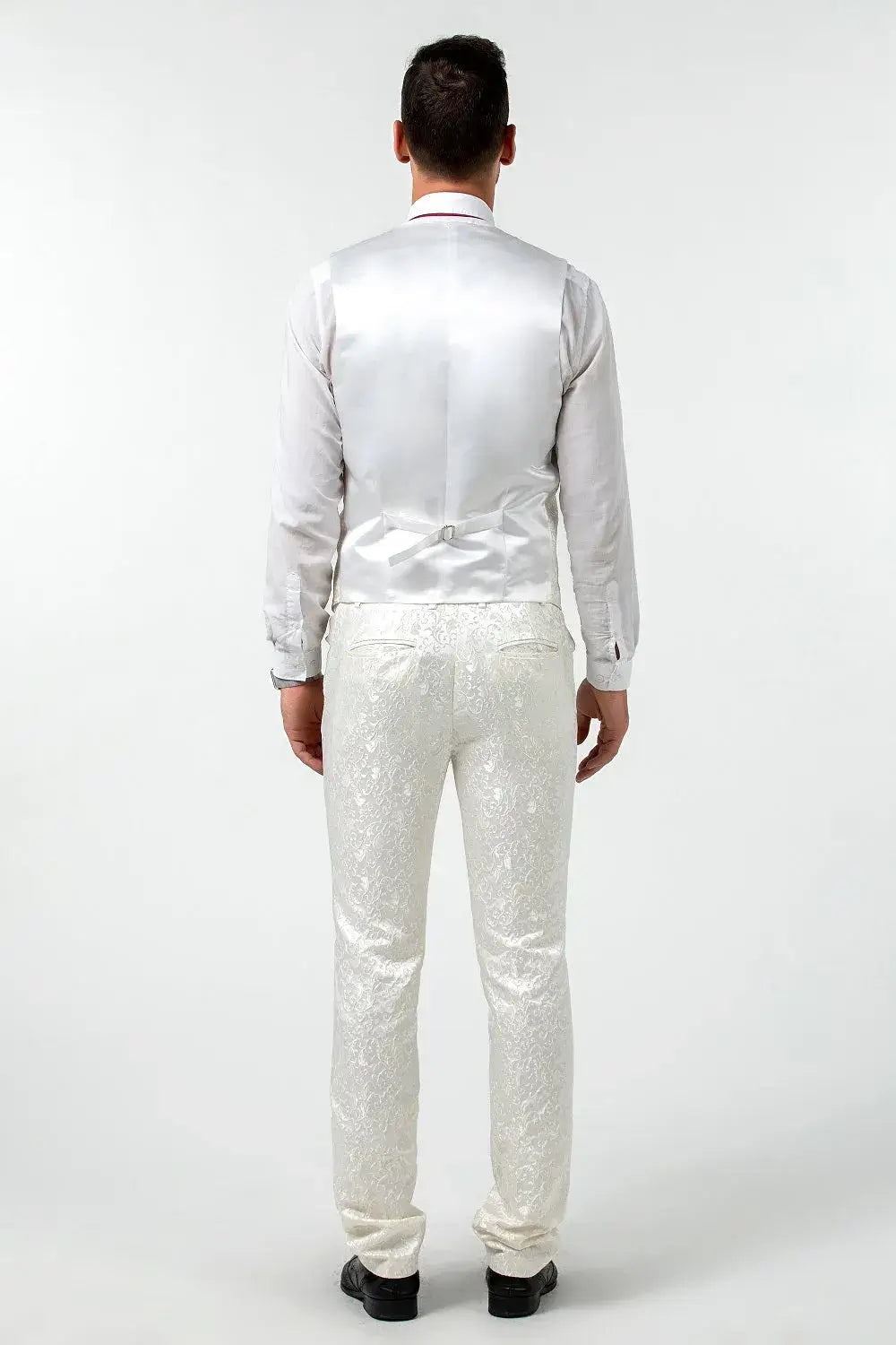 Back view of men's white floral vest and trousers from prom suit – fashion-forward party attire