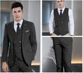 Load image into Gallery viewer, black double-breasted men's 3 piece suit – includes slim fit blazer, vest, and tailored trousers shown on model
