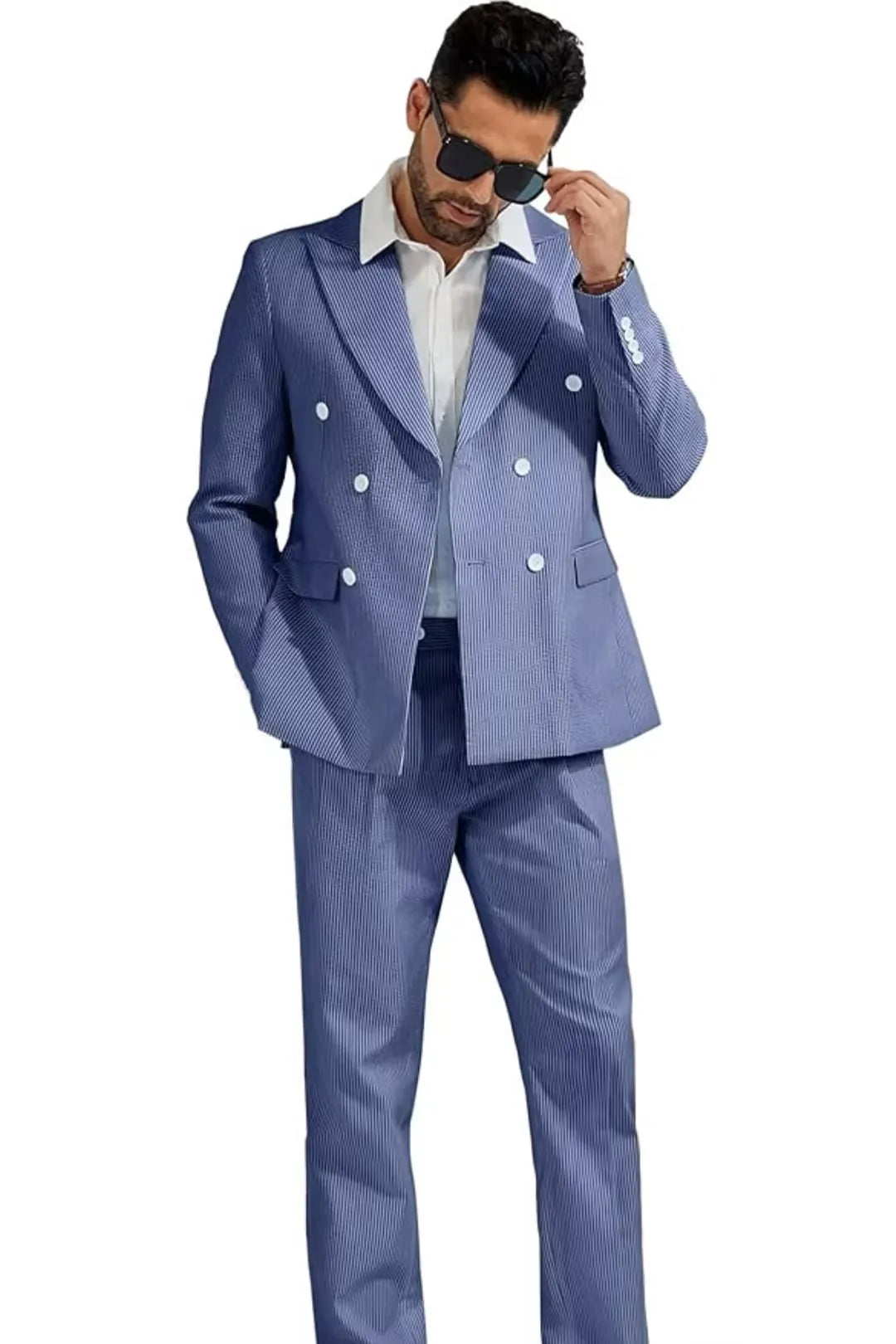 model wearing a blue double-breasted seersucker suit, with a casual pose and sunglasses, showcasing the modern summer style.