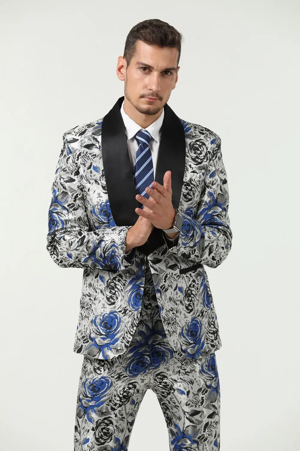 Close-up of blue floral suit blazer with bold rose pattern – formal party attire for men