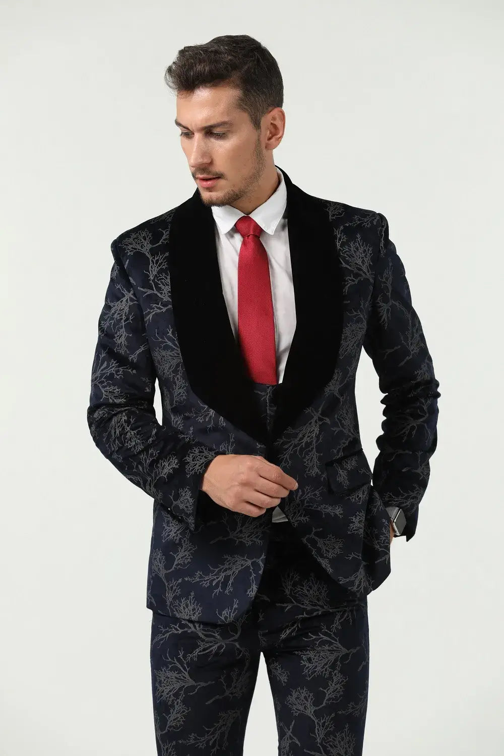 Close-up of navy patterned velvet jacket with red tie – men's formal party suit