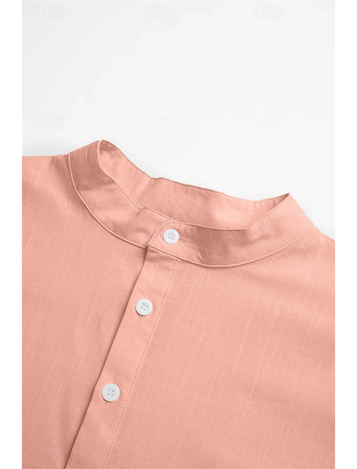 Close-up of pink linen shirt collar and buttons – casual lightweight Henley top for men