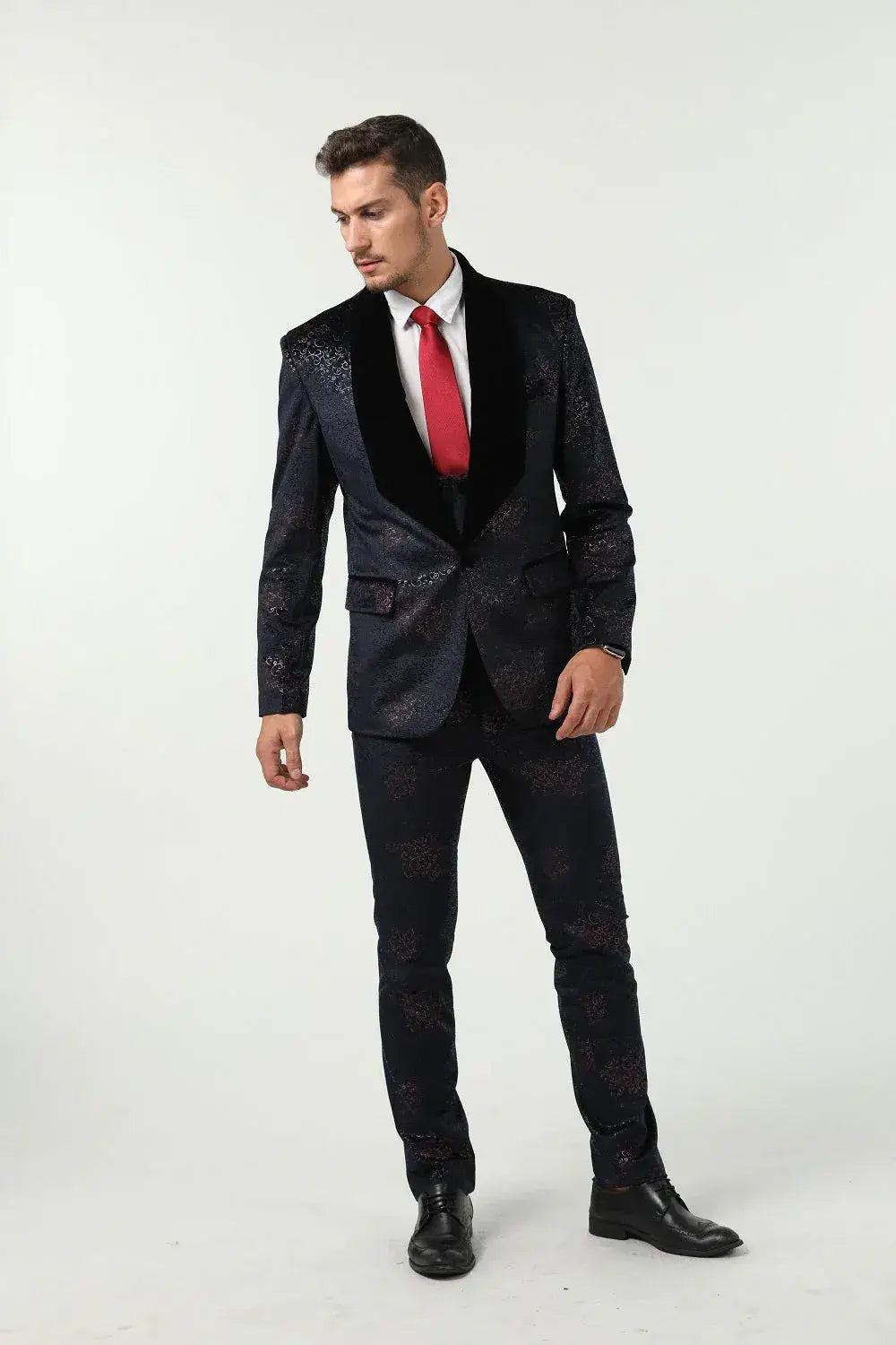 Front view of men's dark navy velvet suit – floral embossed texture with red tie