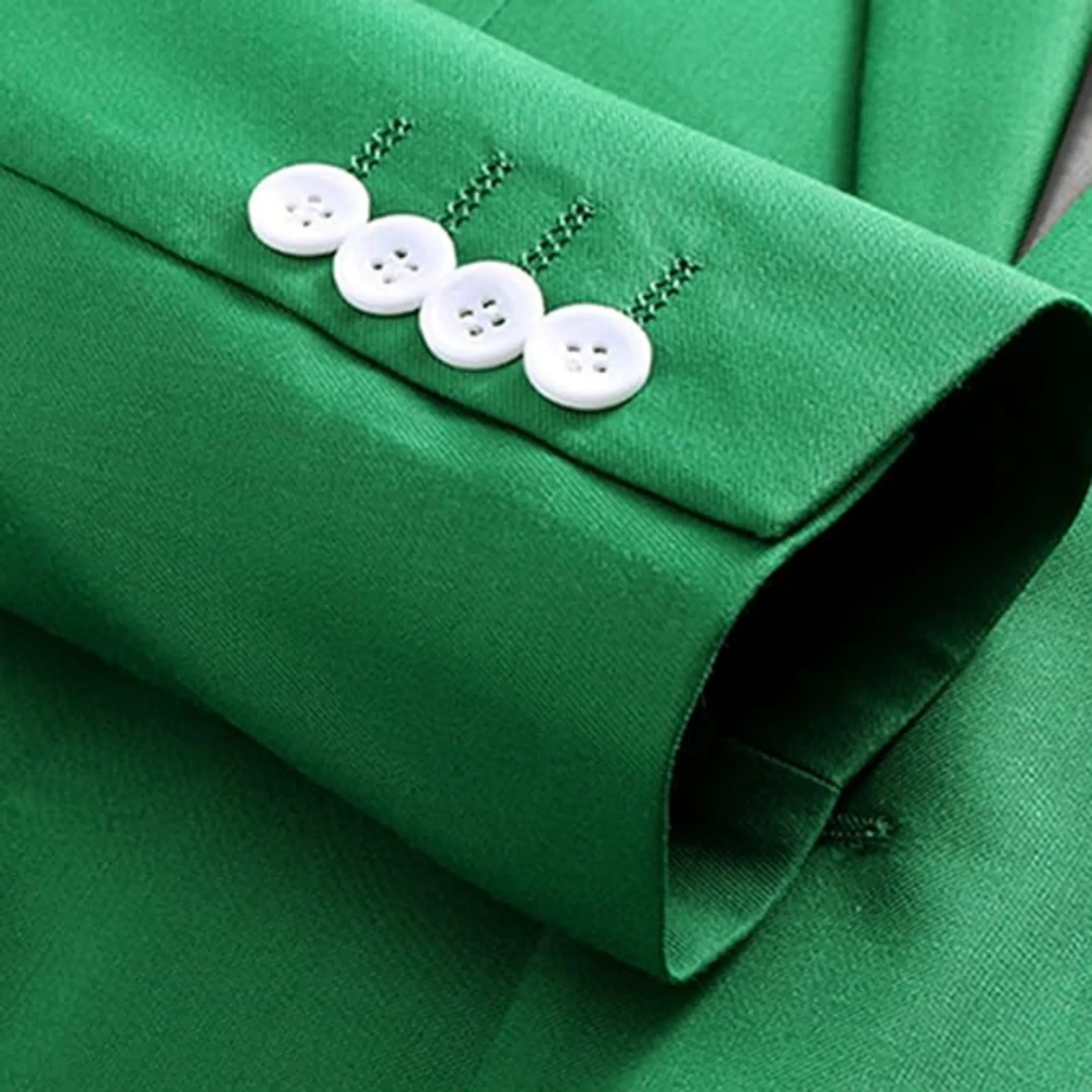 close-up of men's green suit blazer showing the white button cuffs and neat finishing, adding a sophisticated touch to the design.