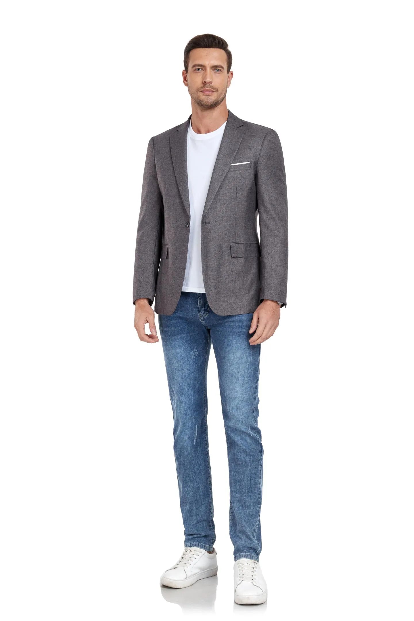 man in grey two-button blazer, white t-shirt, jeans, and sneakers, standing confidently – perfect for events.