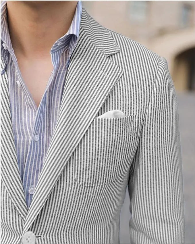 Close-up of grey seersucker jacket lapel and pocket – textured striped fabric for warm weather