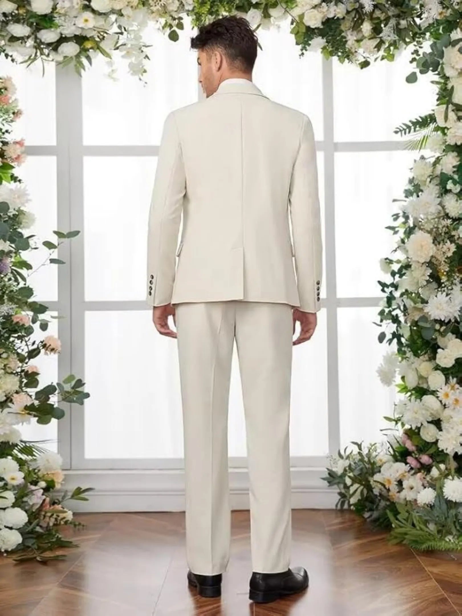 back view of ivory slim fit wedding tuxedo for men in formal setting