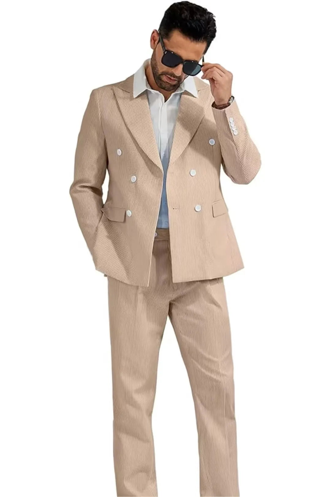 full body view of man wearing a khaki double-breasted seersucker suit with a relaxed, stylish look.