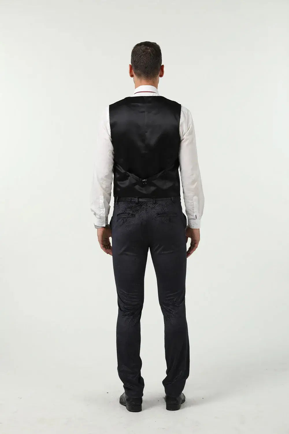 Rear view of navy velvet vest and slim fit pants – elegant men's formal party suit