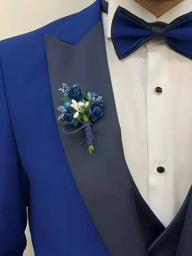 close-up of royal blue formal suit with bow tie and floral boutonniere