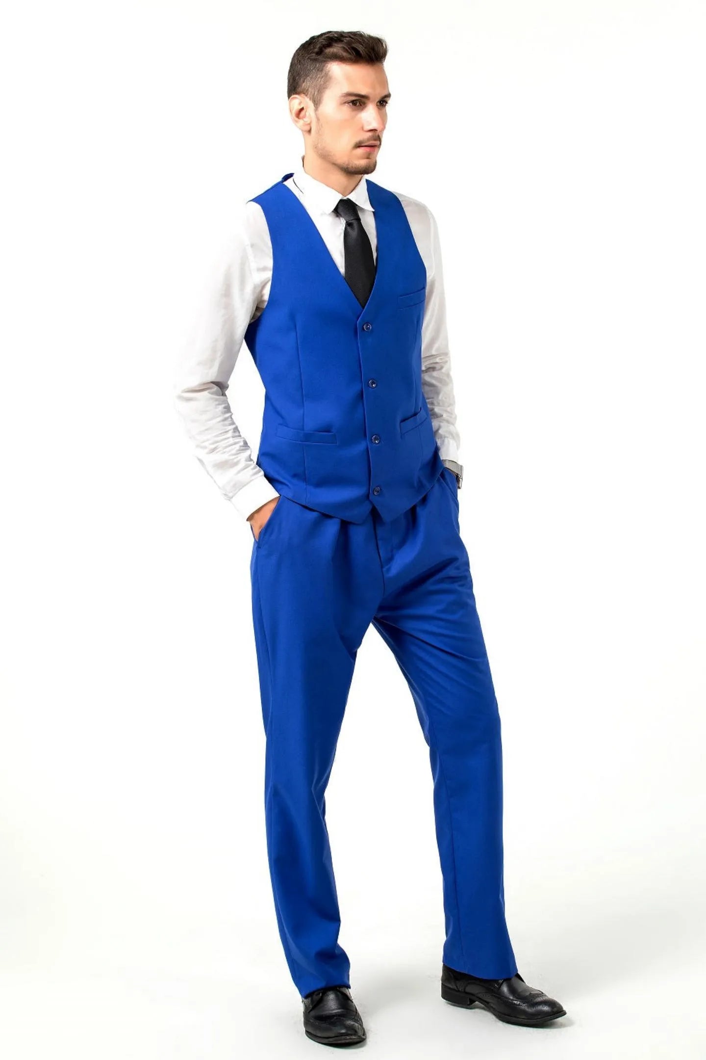 model in royal blue slim-fit suit vest and pants, paired with a black tie, showcasing the tailored look from the side.
