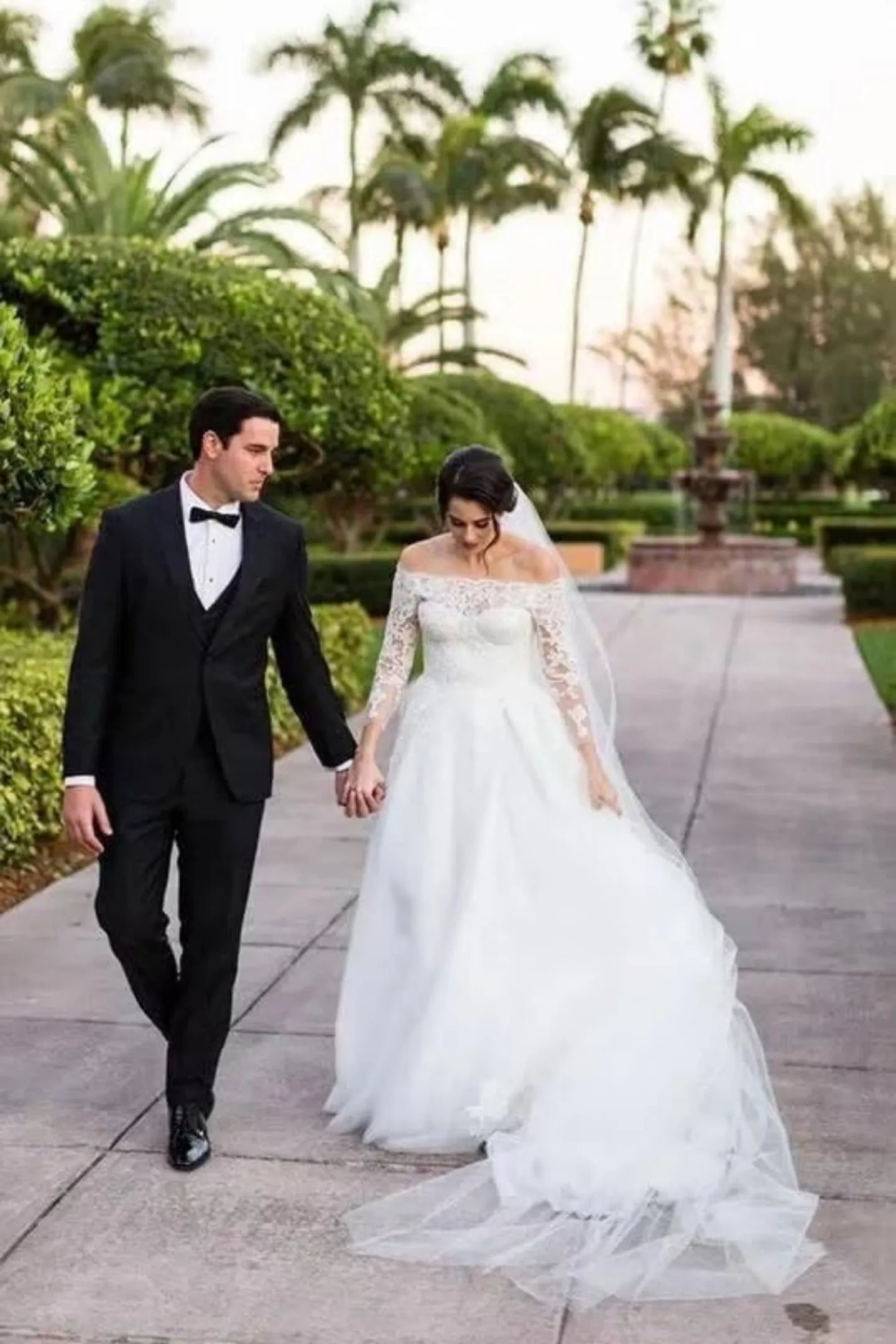 slim fit black tuxedo for men in wedding ceremony with bride in white gown