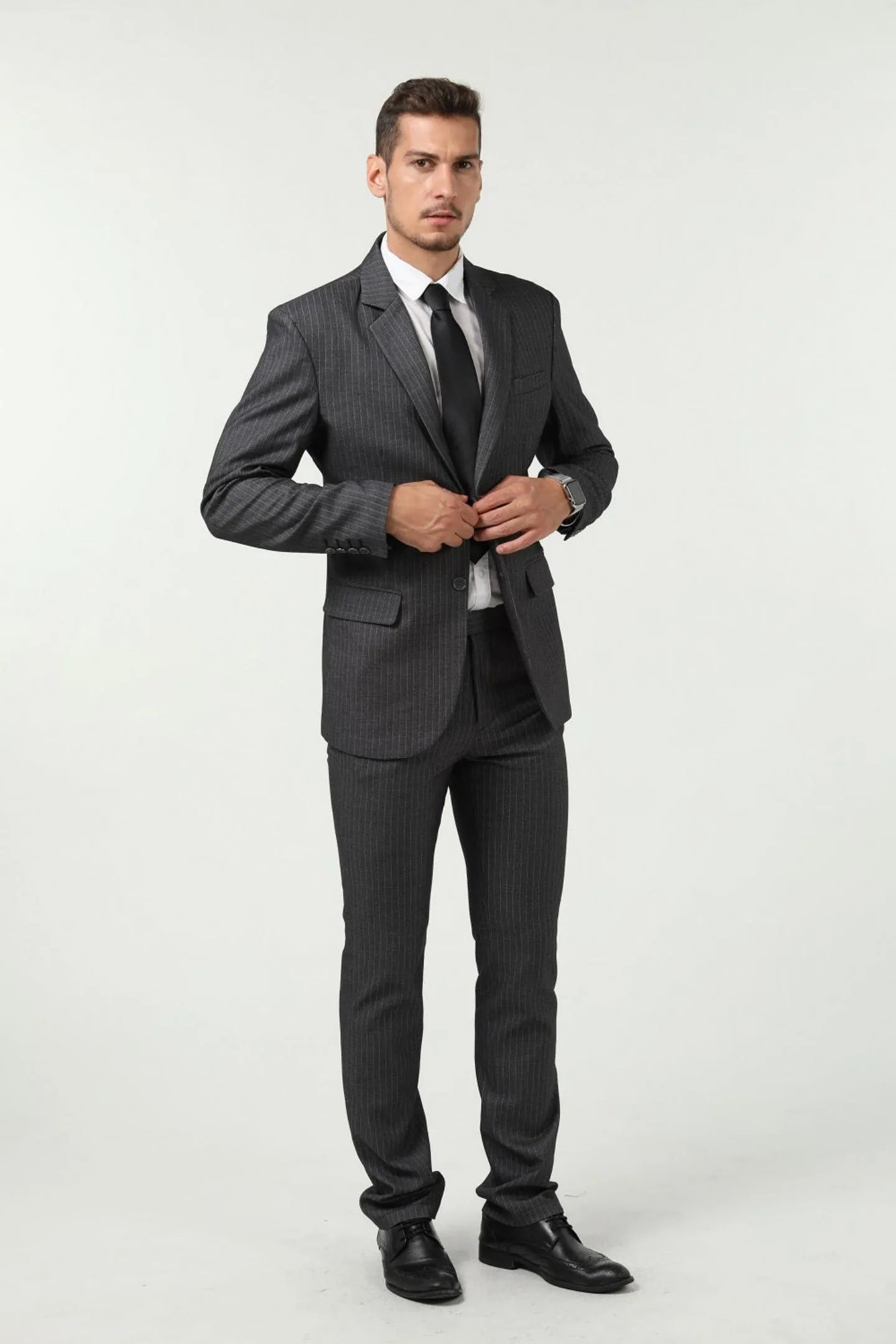 model wearing gray slim fit pinstripe 3 piece men's suit – front view, tailored work & formal outfit with red tie.