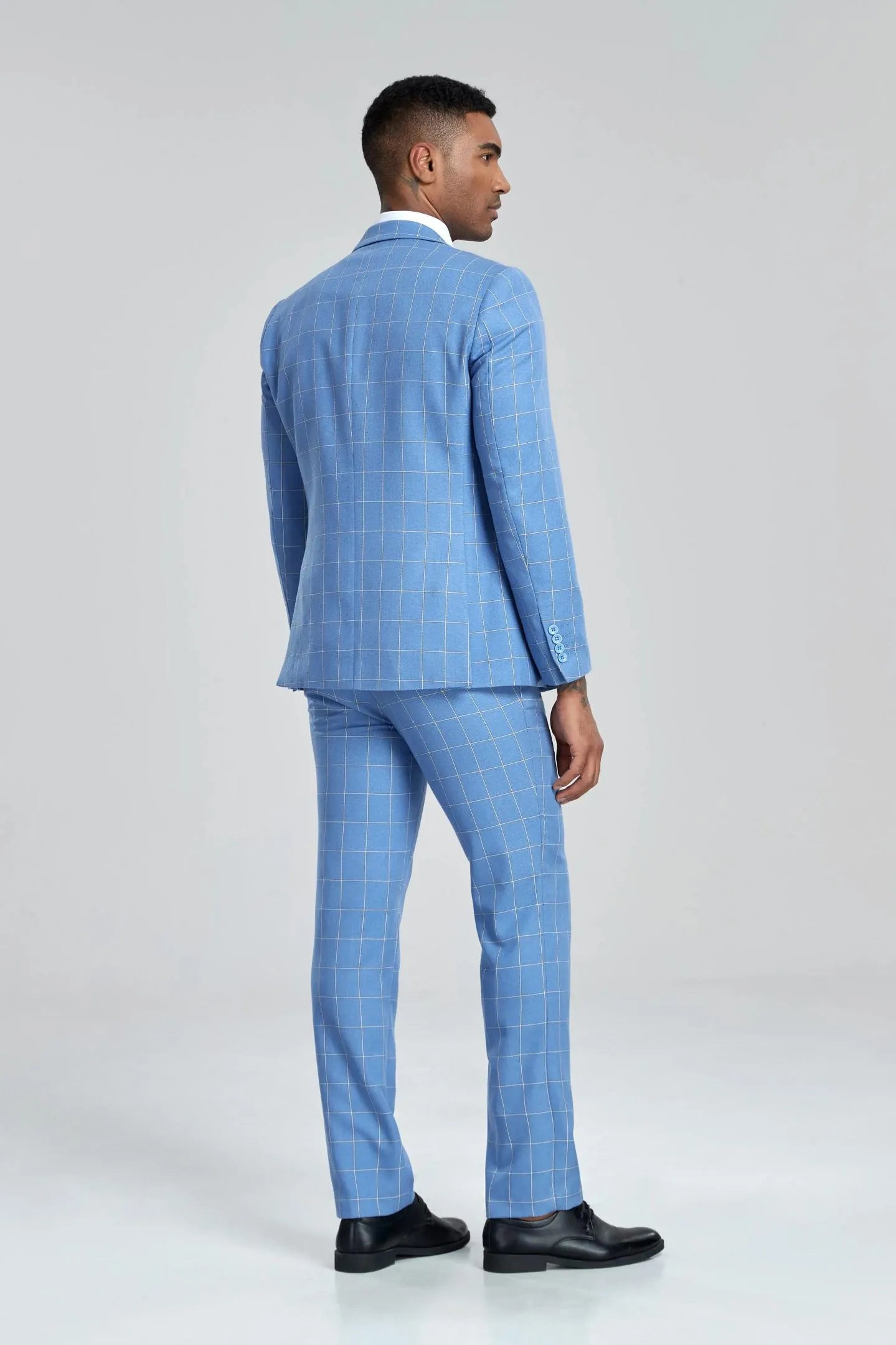 standalone shot of the light blue plaid suit pants, flat front with belt loops, showcasing the slim cut.