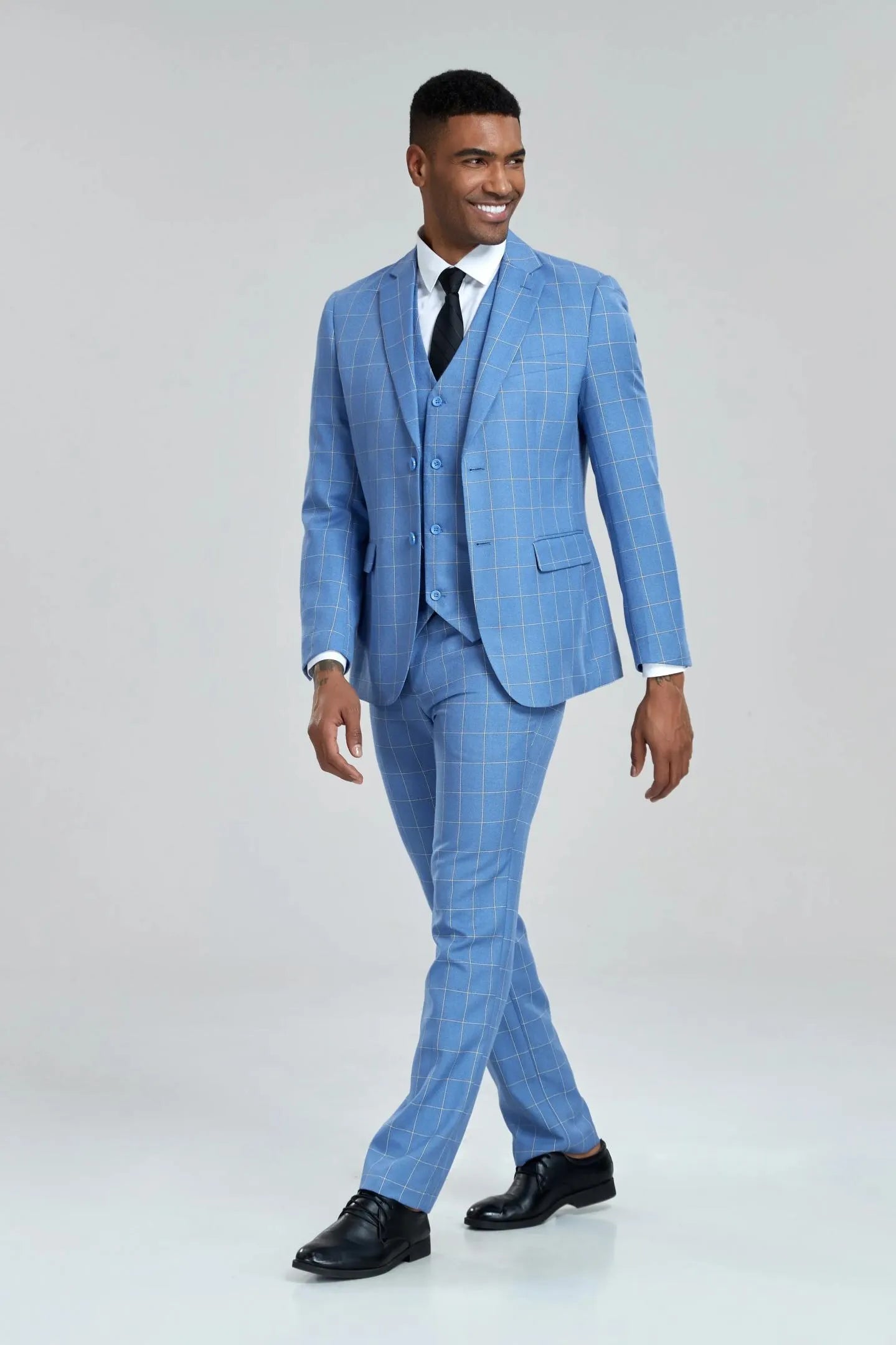 close-up of the vest front in light blue plaid 3-piece suit, highlighting the slim fit and structured design.