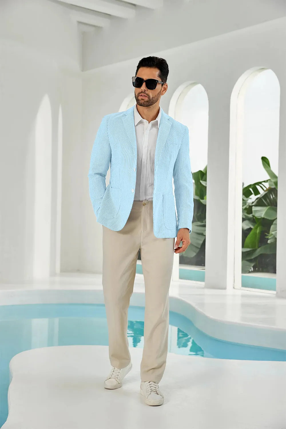 Aqua-white seersucker striped men's summer blazer on model