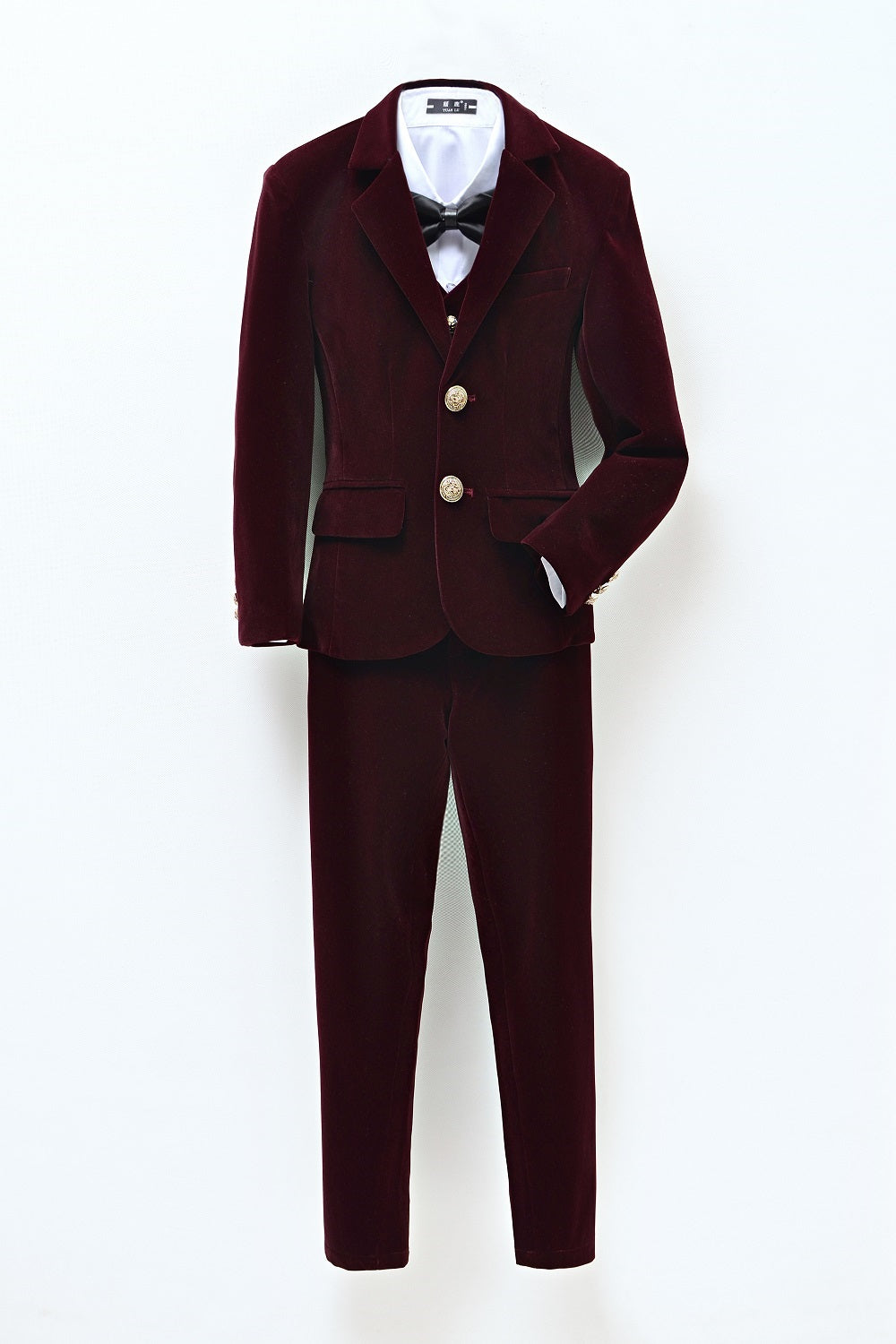 Burgundy velvet 3-piece boy's formal suit with gold buttons & black bow tie – elegant wedding/party outfit