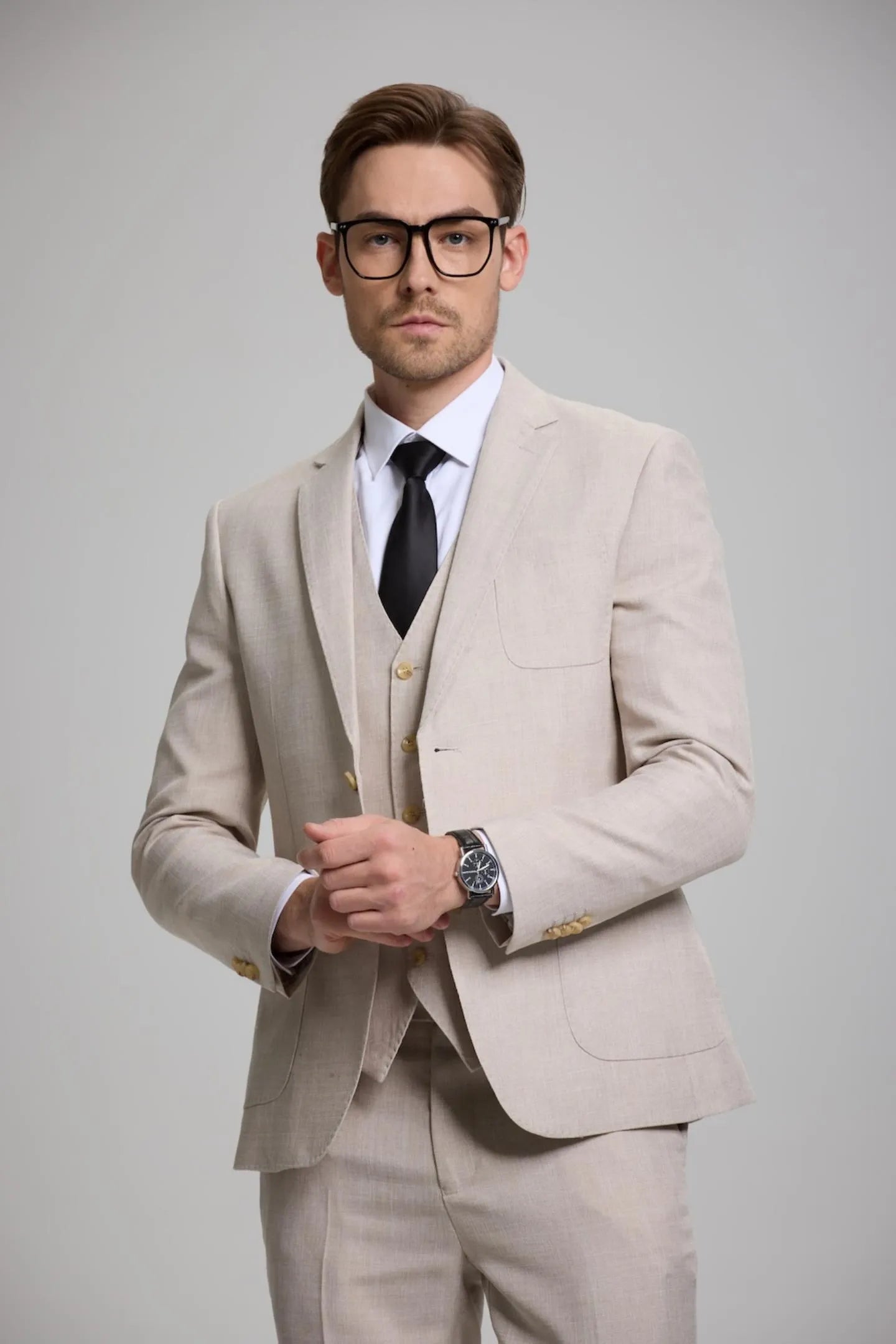 close-up of men's beige gray 3-piece suit with vest and blazer – perfect for groom or business events.