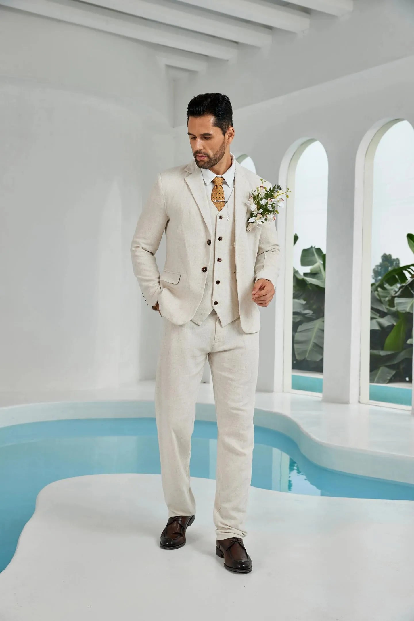 side angle of beige linen 3 piece groom suit for men – blazer, vest, and trousers tailored for summer wedding style