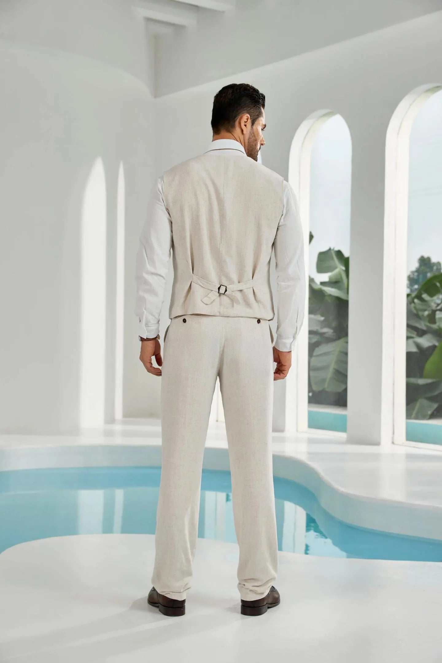 back view of beige linen suit for men – casual 2 piece summer outfit showing vest buckle and tailored pants design