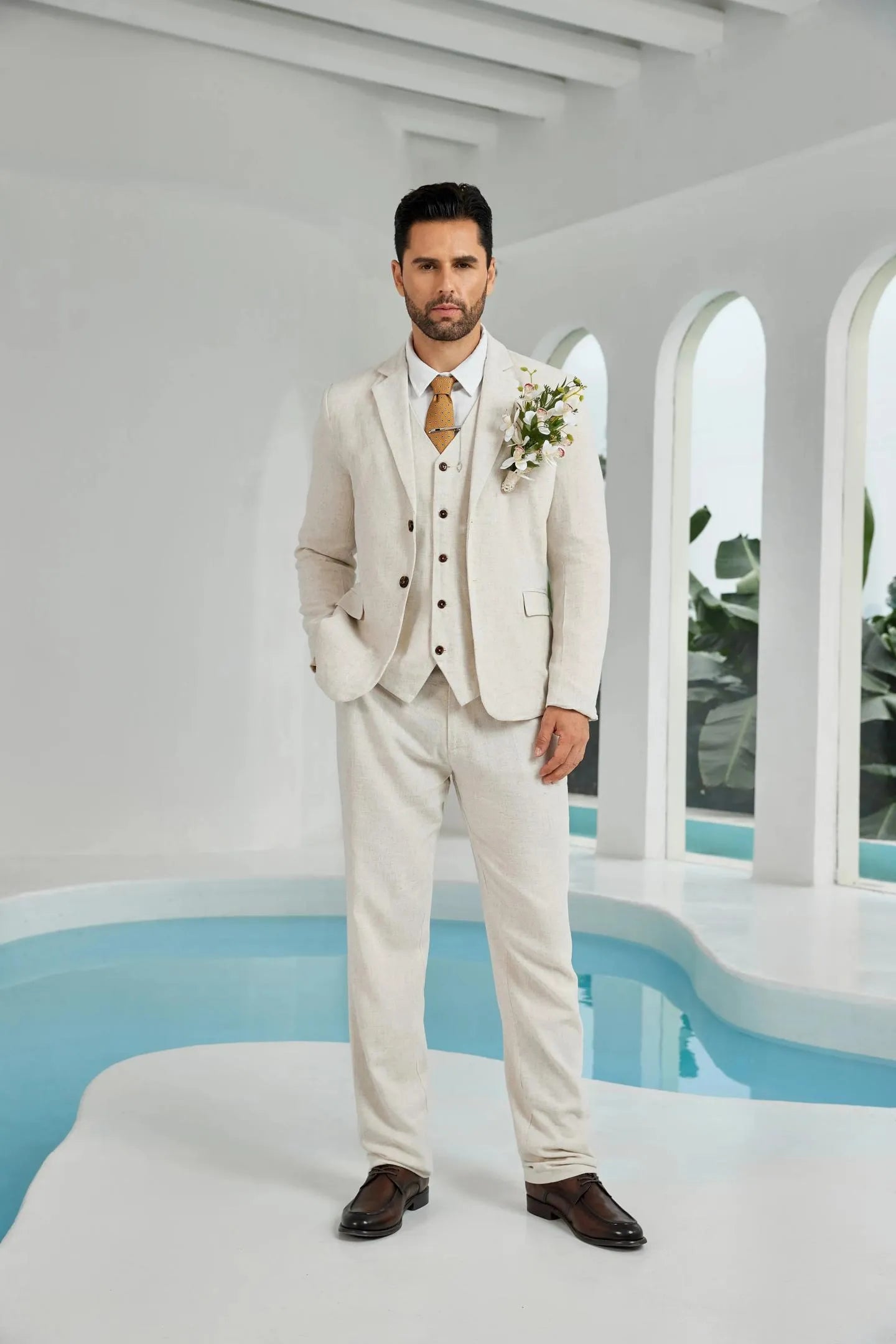 front view of beige linen 3 piece suit for men – blazer, vest, and pants styled as groom wedding outfit with boutonniere