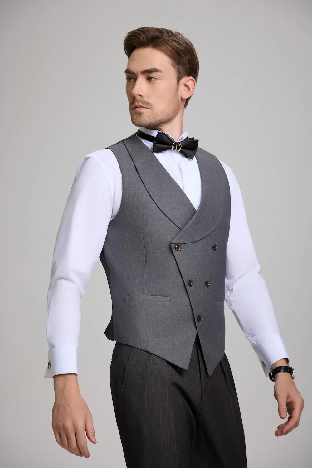 A detailed view of the grey double-breasted waistcoat, showing its unique cut and button details.