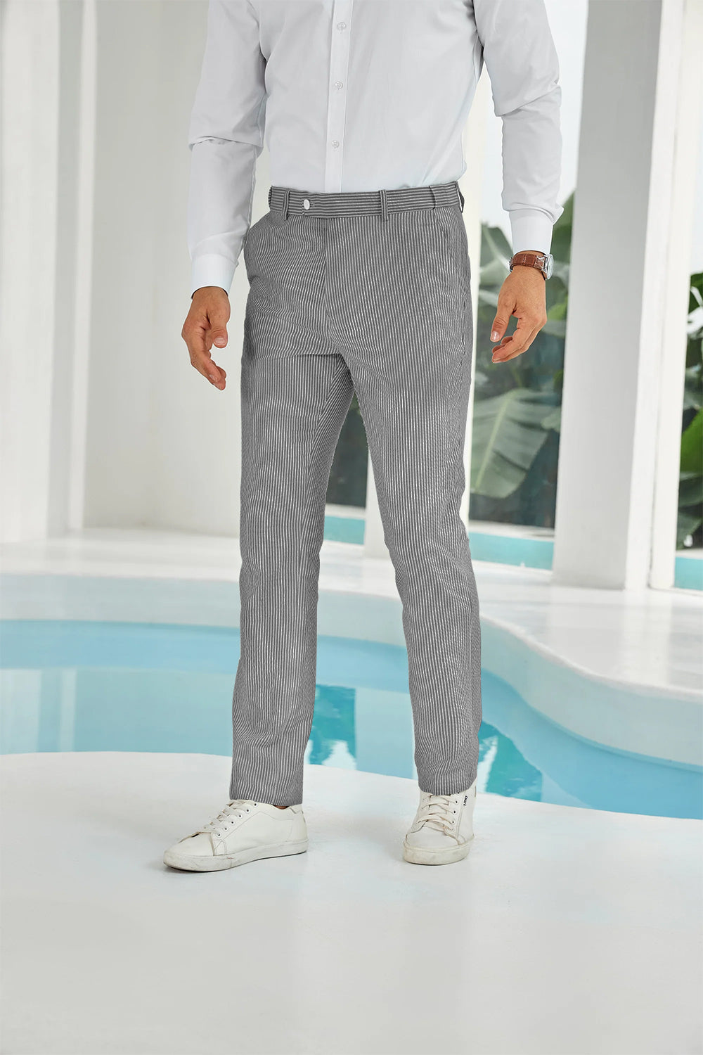 Front view of black seersucker pants with subtle stripes and white shirt