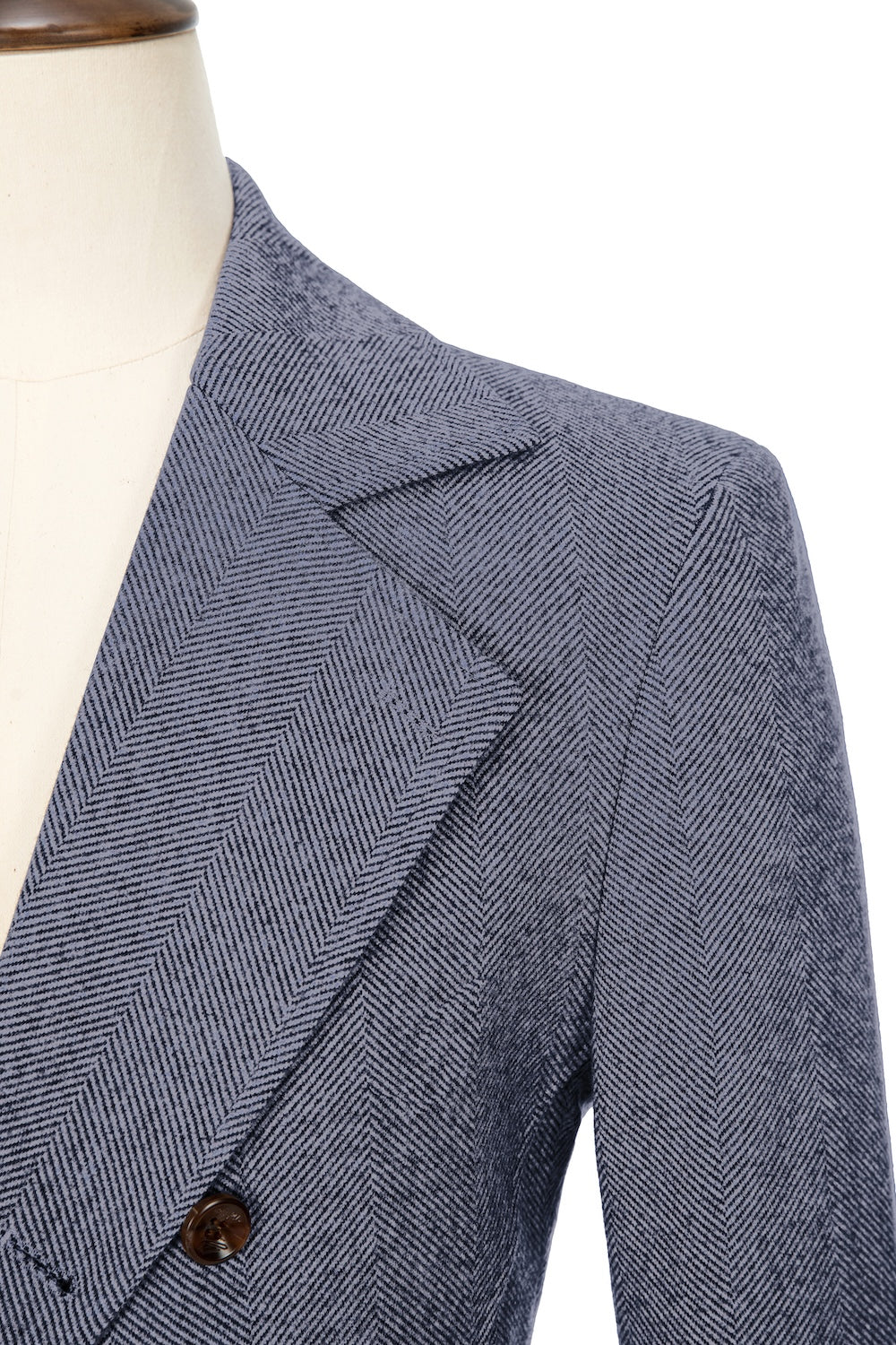 Blue close-up of lapel detail on double-breasted wool coat