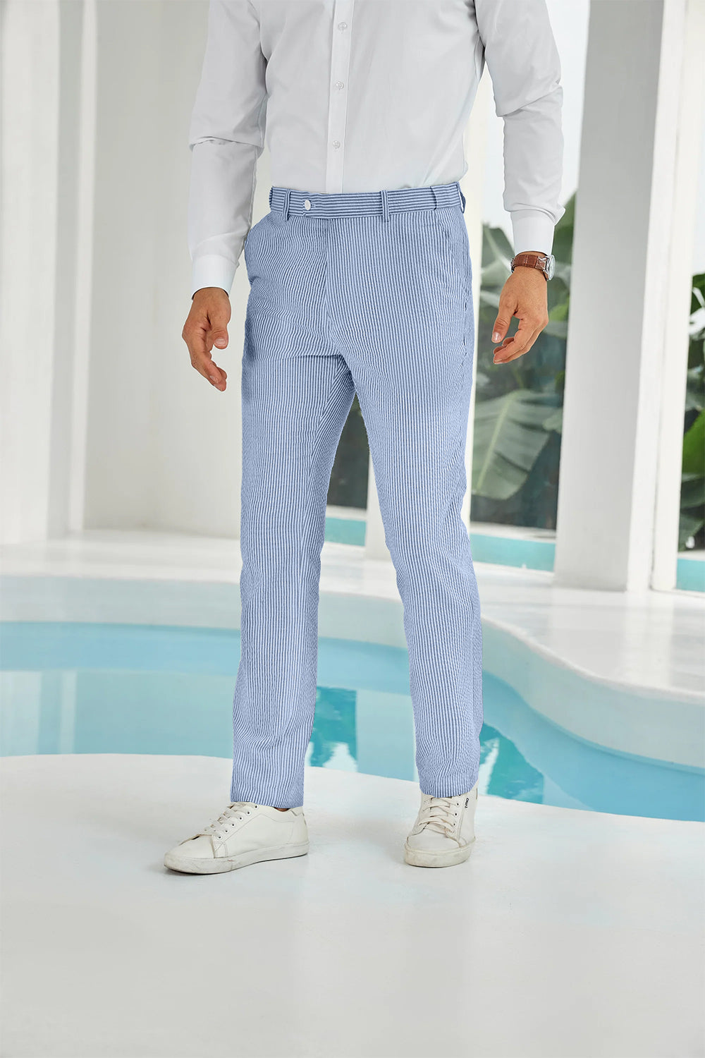 Front view of blue seersucker pants with subtle stripes and white shirt