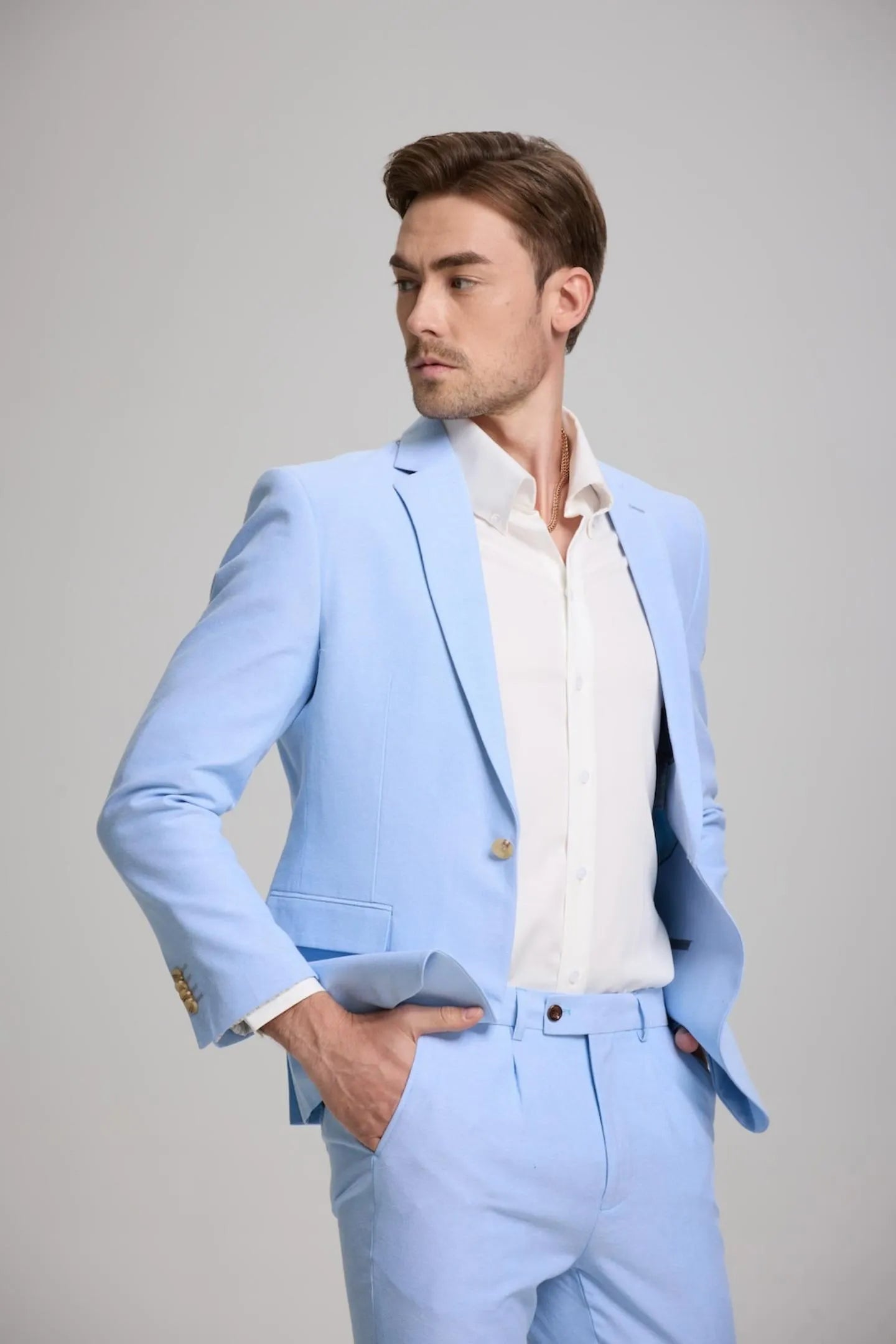 side view of men's blue slim fit suit, featuring a modern blazer and matching pants, ideal for business or casual settings.
