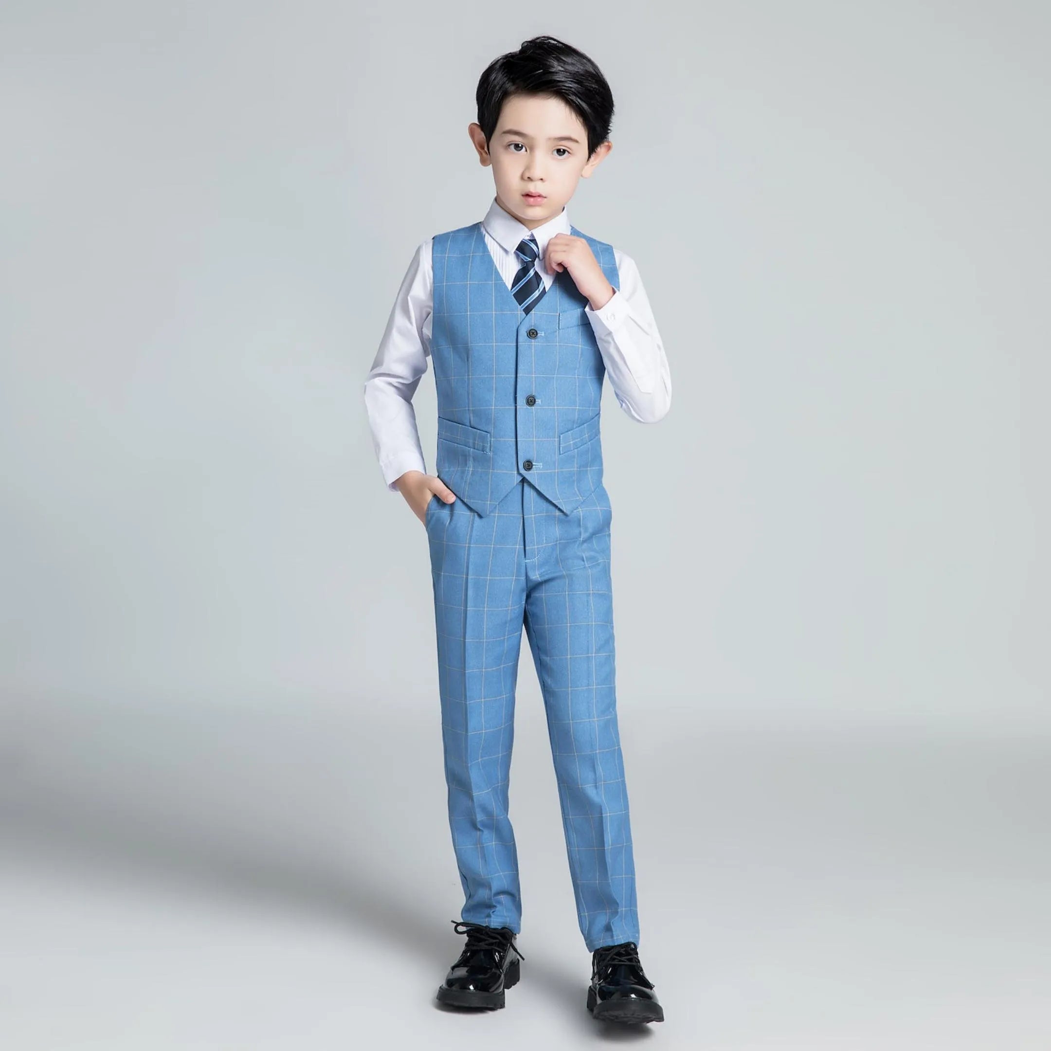 Blue plaid boys 3-piece vest outfit with striped tie and dress pants