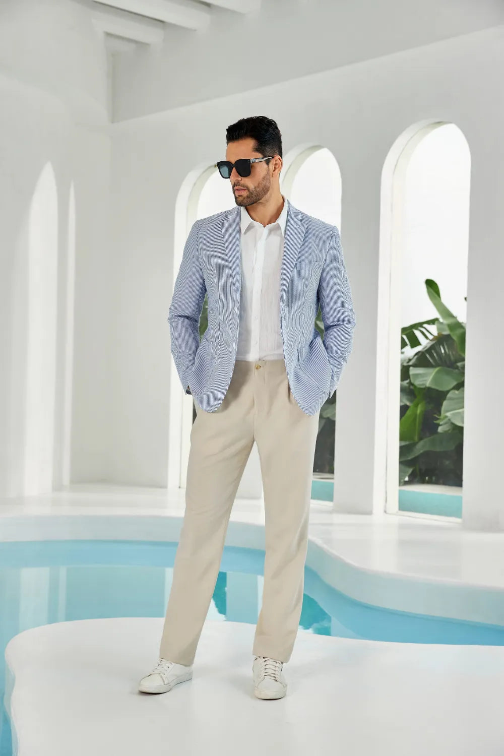Blue-white seersucker striped men's summer blazer on model