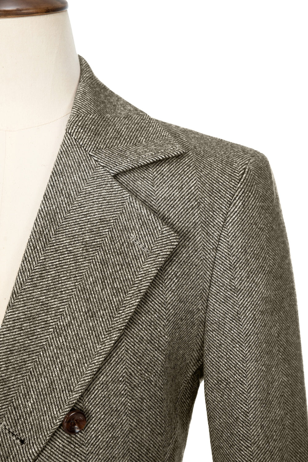 Brown close-up of lapel detail on double-breasted wool coat