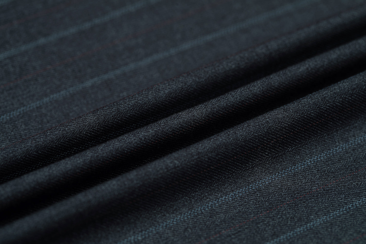 Close-up of fabric texture showing fine chalk pinstripes – formal blazer