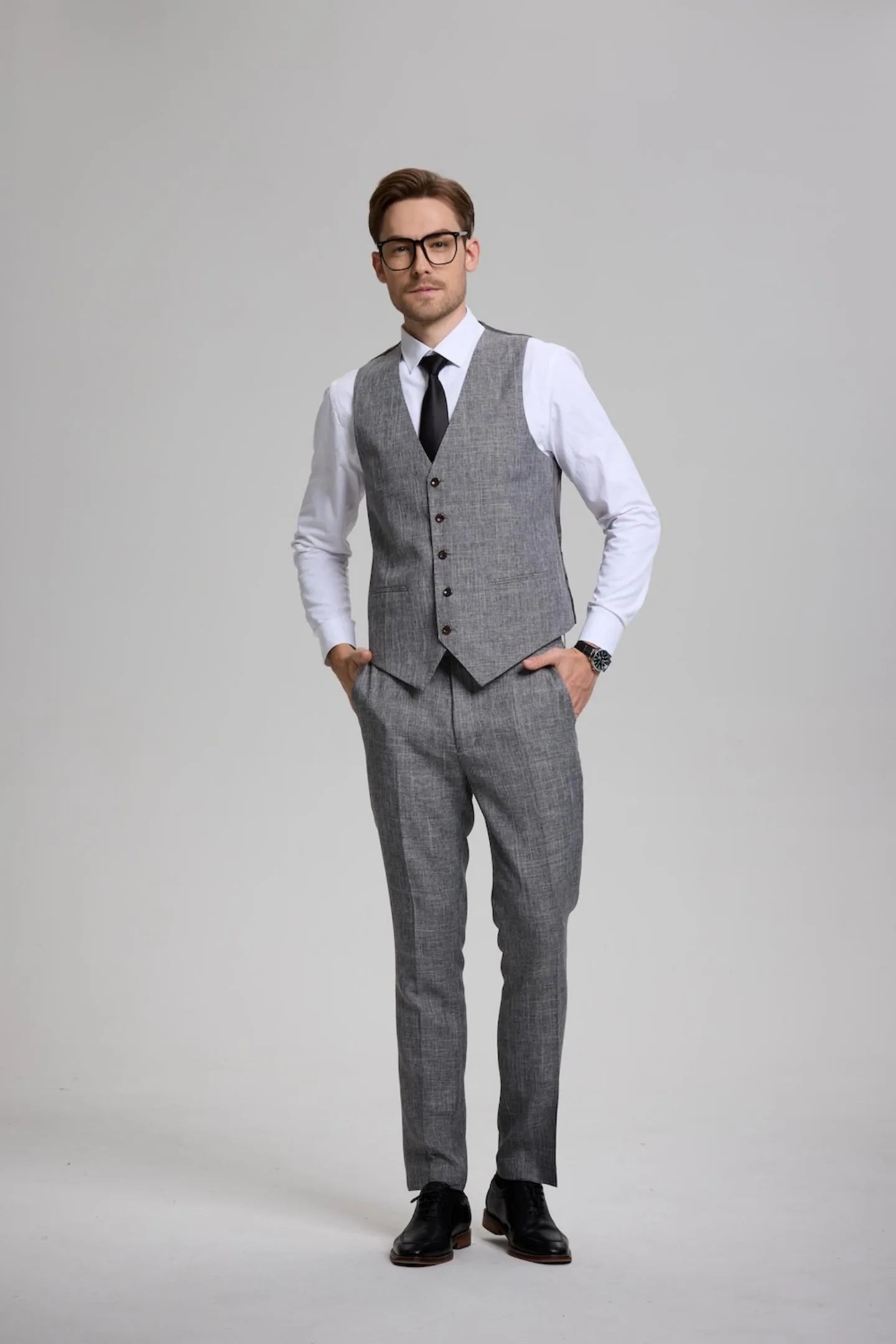 men's dark grey formal 3-piece suit in action – perfect business attire with vest, blazer, and trousers.