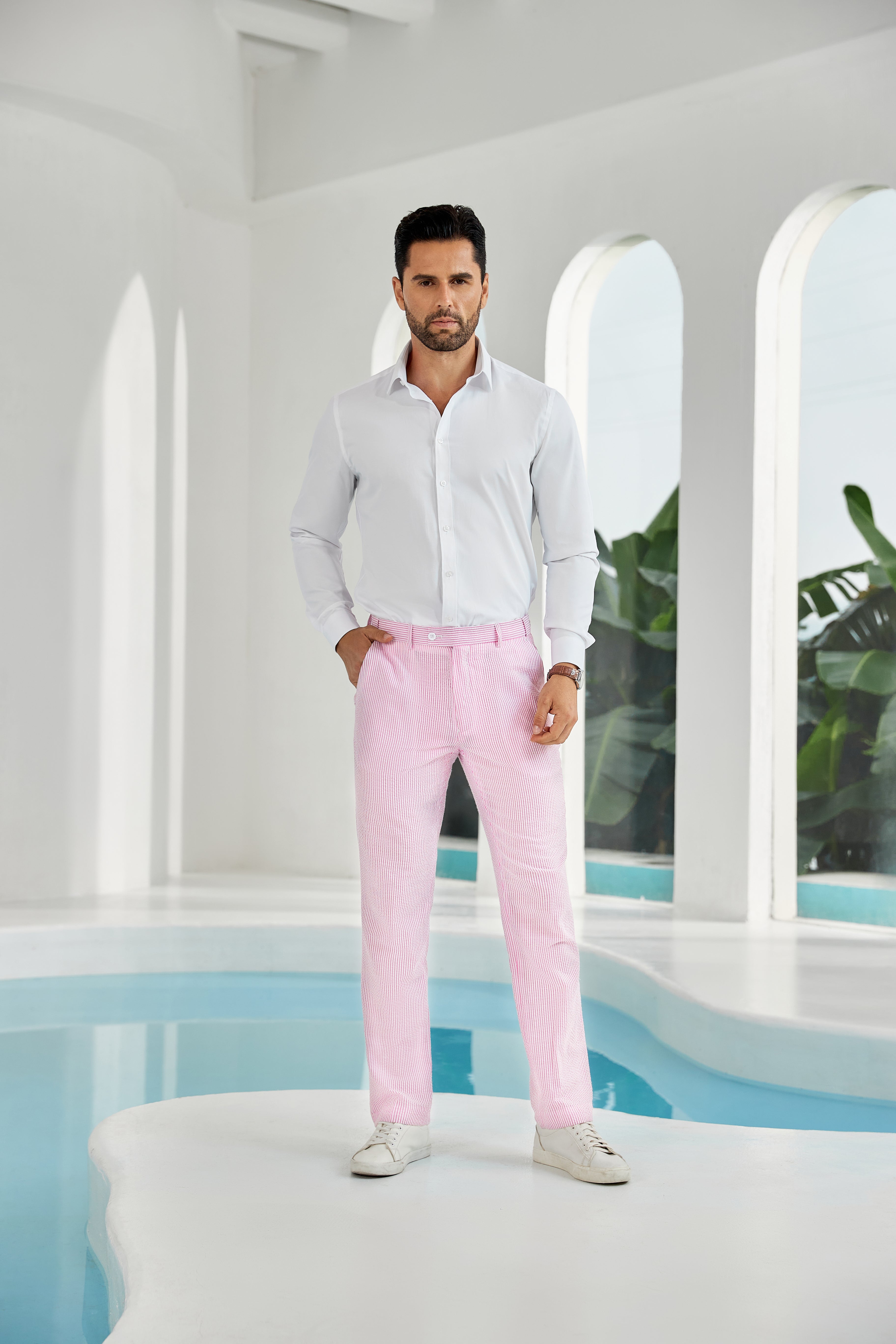 Full-body look: man in dark pink seersucker pants, white shirt, and sneakers