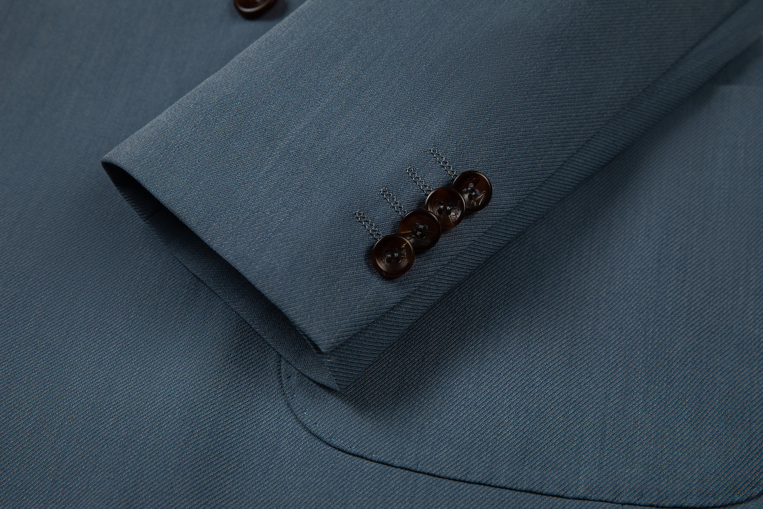 Men's blue double breasted blazer cuff detail - brown horn buttons & textured fabric on designer jacket sleeve