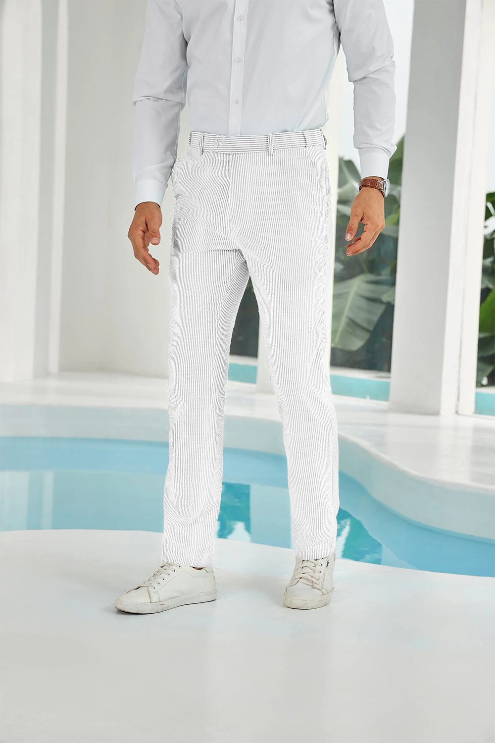 Front view of full white seersucker pants with subtle stripes and white shirt