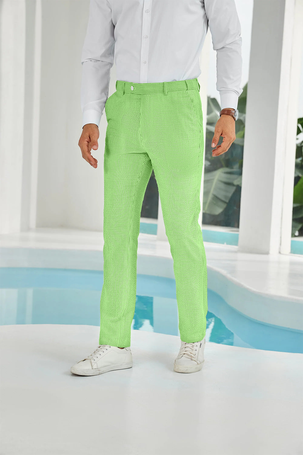 Front view of green seersucker pants with subtle stripes and white shirt