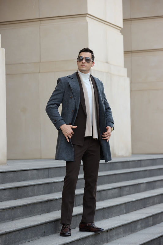 Full body shot of man in grey wool overcoat with layered suit – classic winter outfit