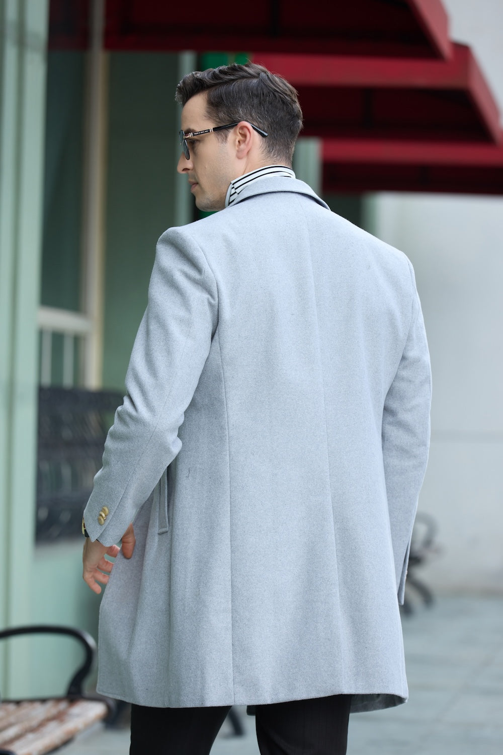 Men's light gray long winter overcoat - back view of trench style wool blend outerwear with button cuffs for men