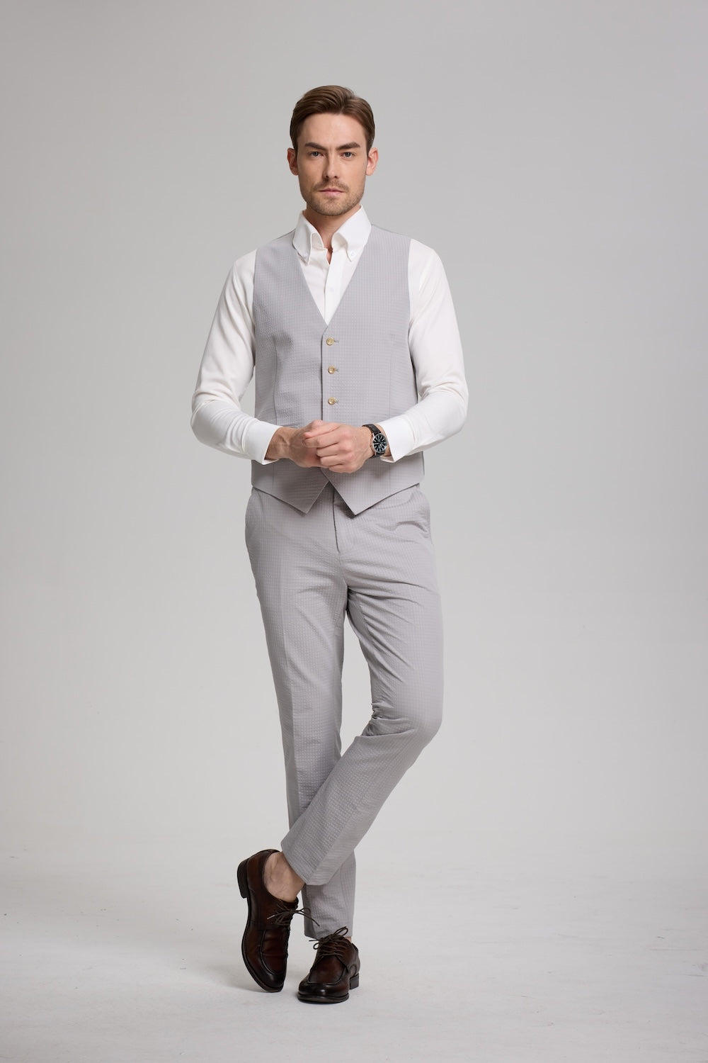 Vest-only look of light grey seersucker suit paired with classic white shirt