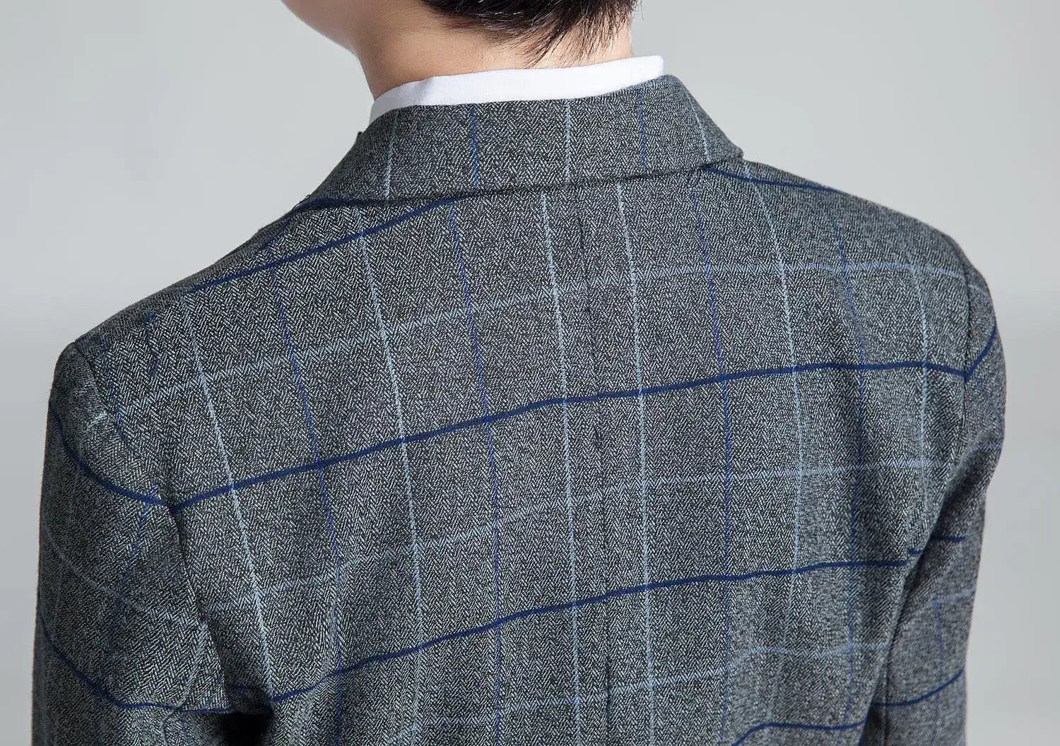 Boys' dark gray plaid suit: Back shoulder view of checked blazer fabric