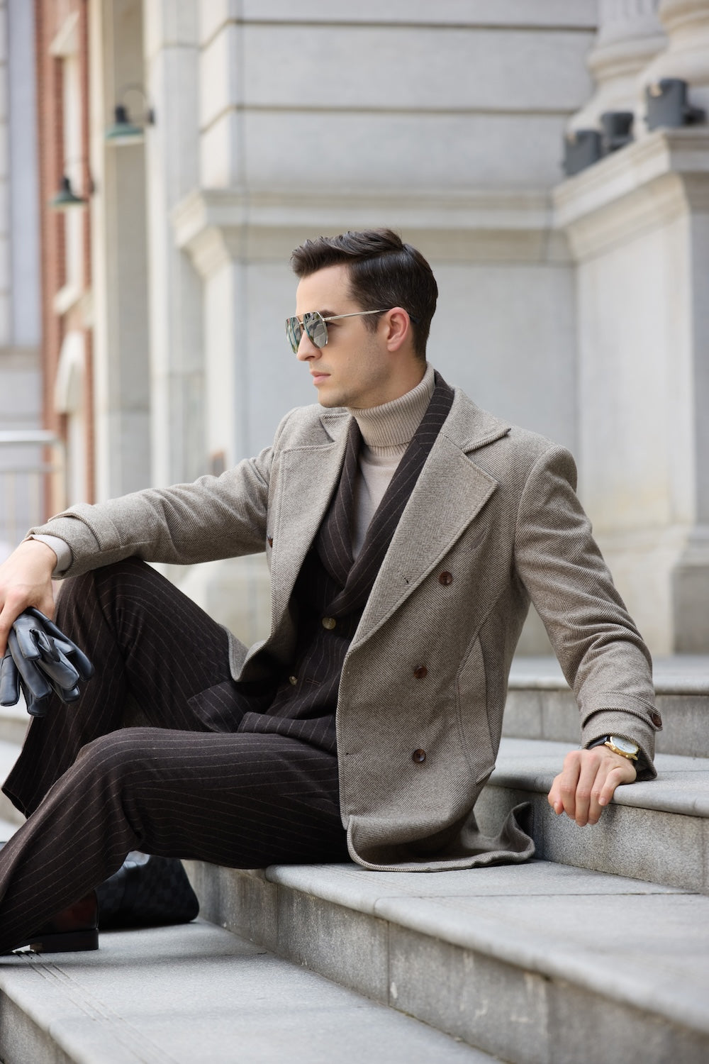 Light coffee long coat for men – seated streetwear outfit with gloves