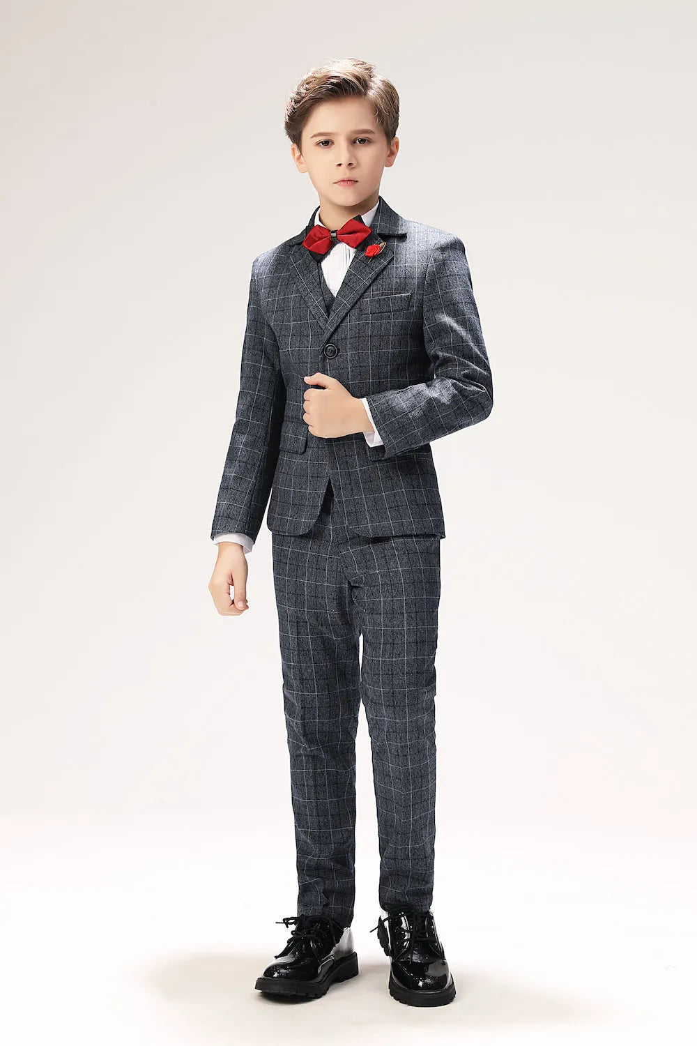 Slim fit grey plaid boys suit with red bow tie, perfect for weddings and formal dress occasions