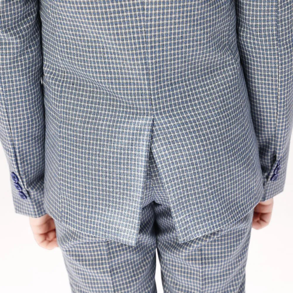 Rear vent detail of boys' plaid blazer highlighting fine formal tailoring