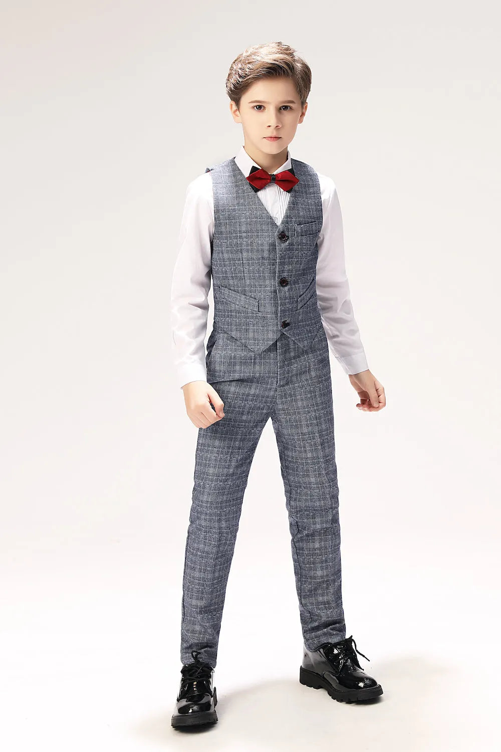 Boys 3-piece vest and pants combo in elegant grey plaid, styled with white shirt and red bow tie