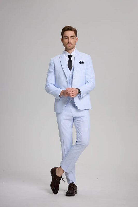 Full-body front view of blue seersucker 3-piece suit with white shirt and black tie