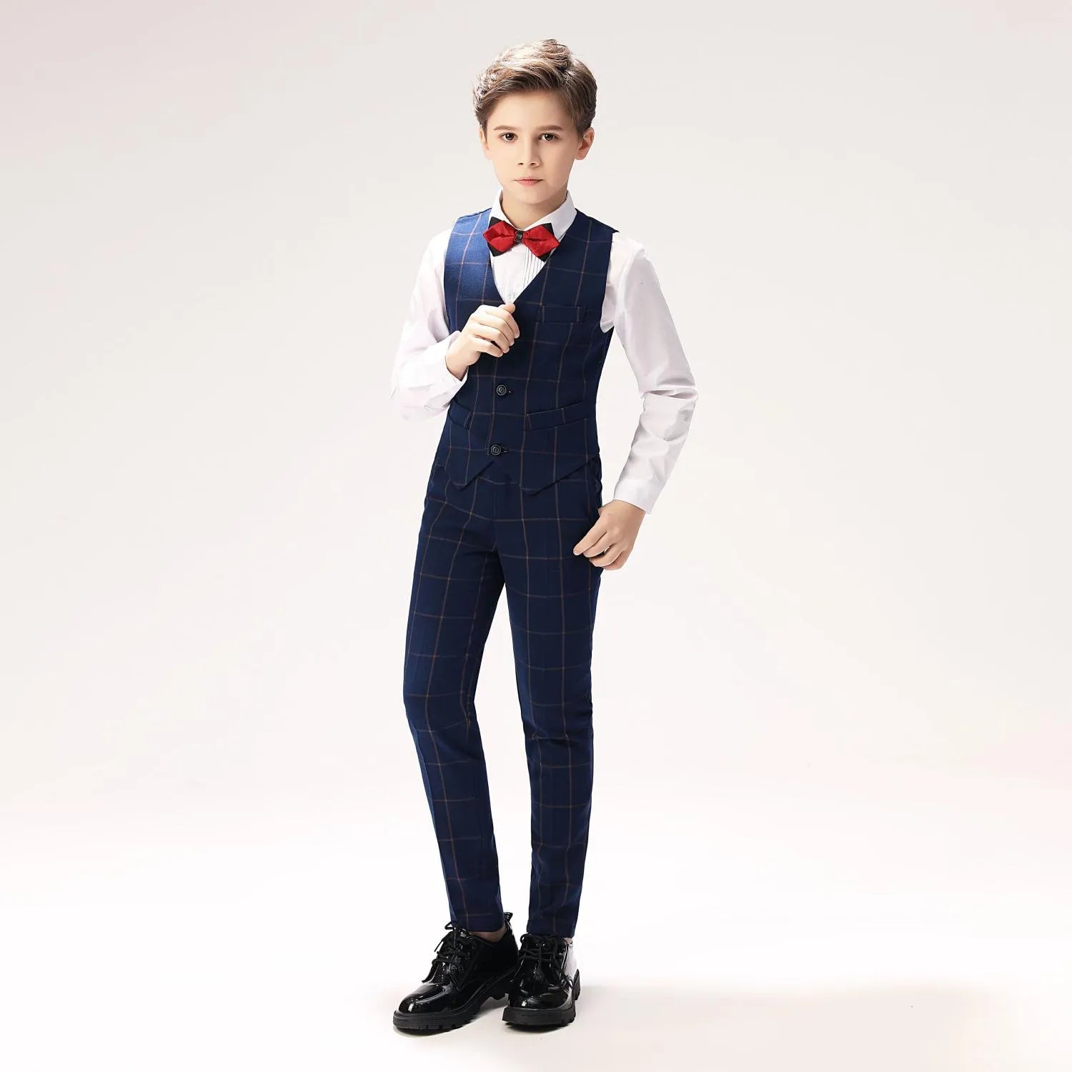 Classic boys plaid vest and trousers with white dress shirt and bow tie