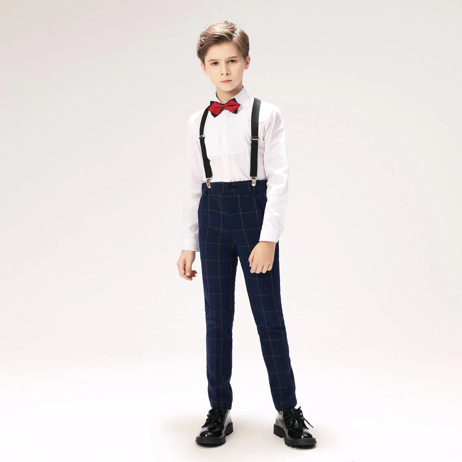 Youth wearing boys checkered formal vest and trousers for parties